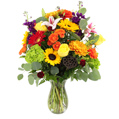 Golden Autumn includes yellow roses, pink roses, red lilies, red & orange gerbers in a vase