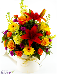 Fall Watering Can includes fall color flower as lilies, roses, gerber and more all in a watering can